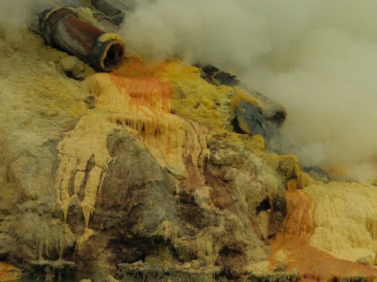 a body of water with steam coming out of it
