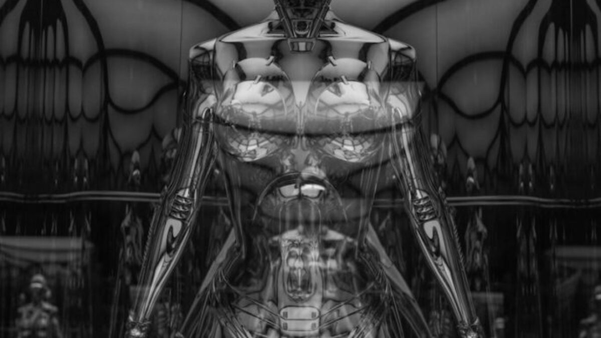 a black and white photo of a futuristic woman