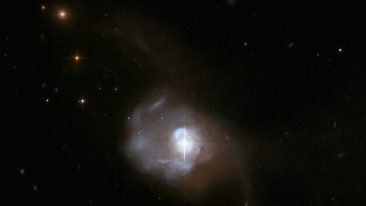 a white object in the middle of a dark sky
