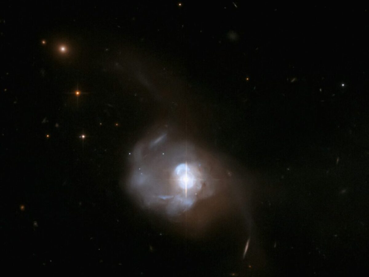 a white object in the middle of a dark sky