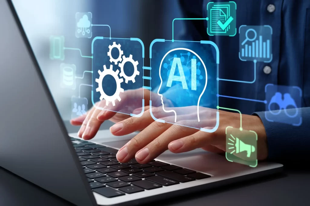 Shutterstock_2603901585 - Techsvět Ruce u laptopu s piktogramy AI