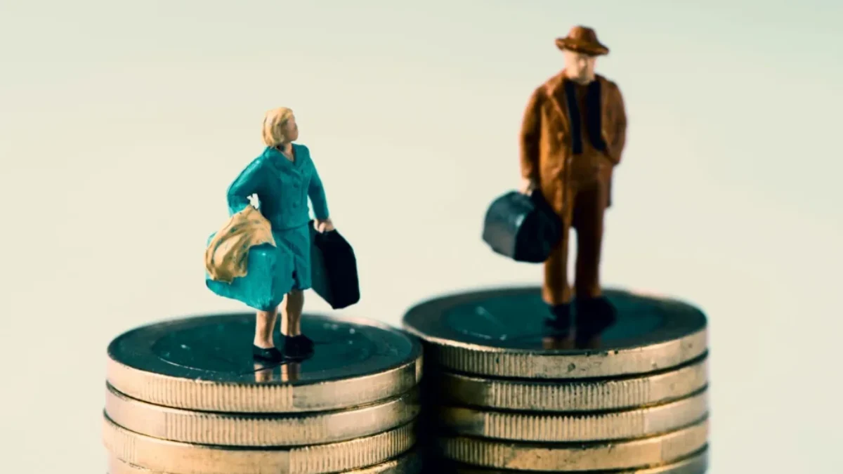 Figurky muže a ženy stojí na mincích