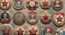 A collection of Soviet-era medal pins featuring red stars, gold wreaths, and hammer-and-sickle symbols on textured fabric.