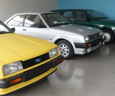 Row of vintage Ford cars in a showroom: yellow car in front, followed by silver and green cars lined up against a blue wall.