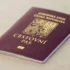 Czech passport with gold crest on a maroon cover resting on a light surface, close-up view