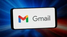 Smartphone screen showing the Gmail app logo: a colorful M icon with the gray 'Gmail' text on a white background