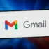 Smartphone screen showing the Gmail app logo: a colorful M icon with the gray 'Gmail' text on a white background